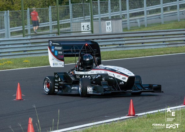 Our third event of the season, Formula Student East 🇭🇺, which took place at the Hungaroring, started with a successful technical scrutineering. The static disciplines were also successful, especially for our autonomous team. We reached the finals in Cost and Manufacturing as well as in Engineering Design. However, during the first dynamic disciplines, we unfortunately encountered technical problems. Not all motors were powered correctly but the team was able to adjust some of the problems on the same day and we were still able to compete in the autonomous disciplines and achieve good results in DV Autocross and DV Skidpad. On the last day, the longest dynamic disciplines were on the agenda, in the electric but also in the autonomous competition. The electric team was able to successfully complete the Endurance event, even if not quite with the desired performance. The efficiency prize, for the most efficient car during the Endurance Event, we still managed to win. In the autonomous competition, unfortunately, luck was not on our side and our system lacked information to follow the track correctly during Trackdrive.<br /><br />Even though a number of problems occurred during the event, the team can be proud of the final results of a 5th place in the driverless and a 6th place in the electric competition.<br /><br />Driverless:<br />🥇Engineering Design<br />🥉Cost and Manufacturing<br />Autocross: 4th place<br />Skidpad: 5th place<br />Electric:<br />🥇Efficiency<br /><br />📸: FSEast